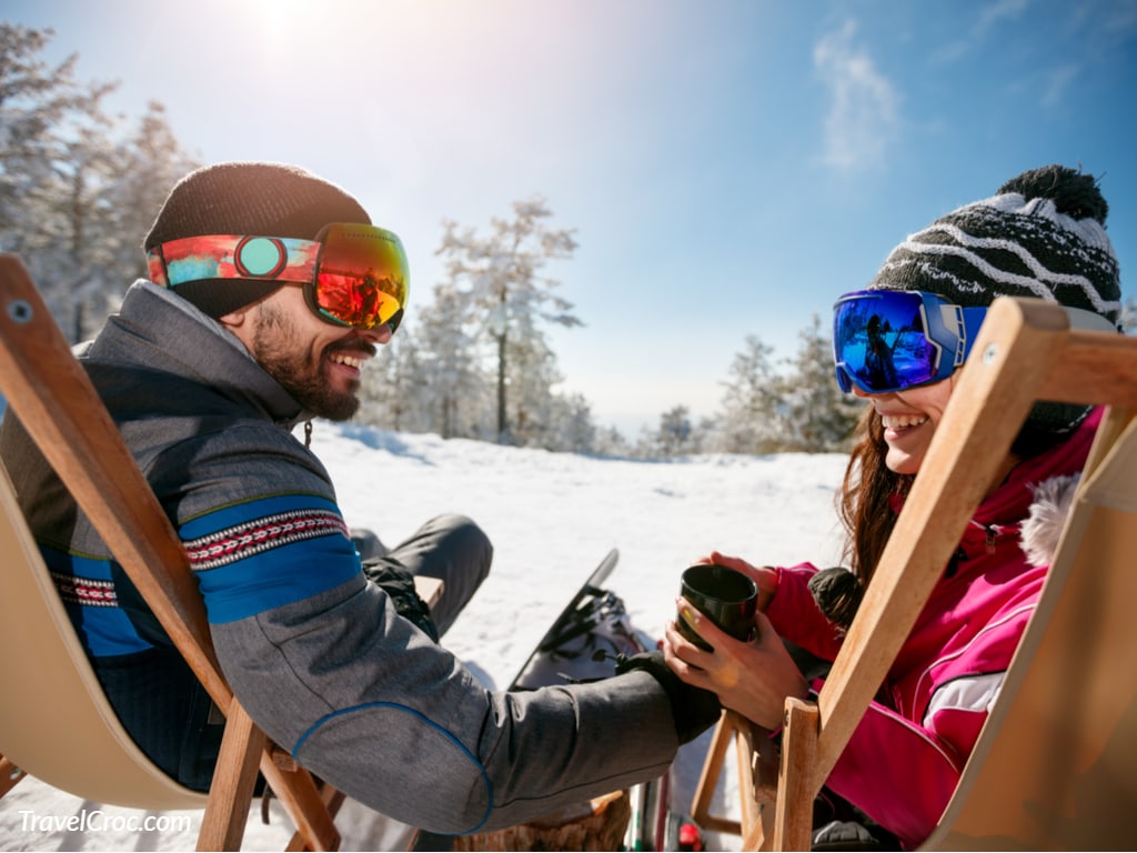 Couple spending time together and drink after skiing