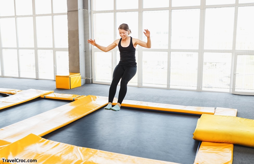 Young woman0 jumping on a trampolin -Things to do in Joplin Mo 
