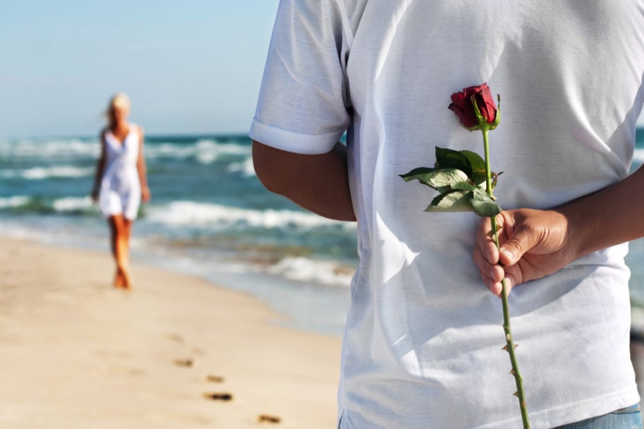 man with rose waiting his woman for romantic date