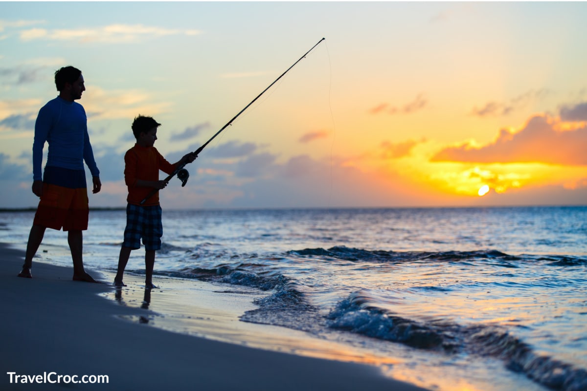 Beach fishing at sunset.