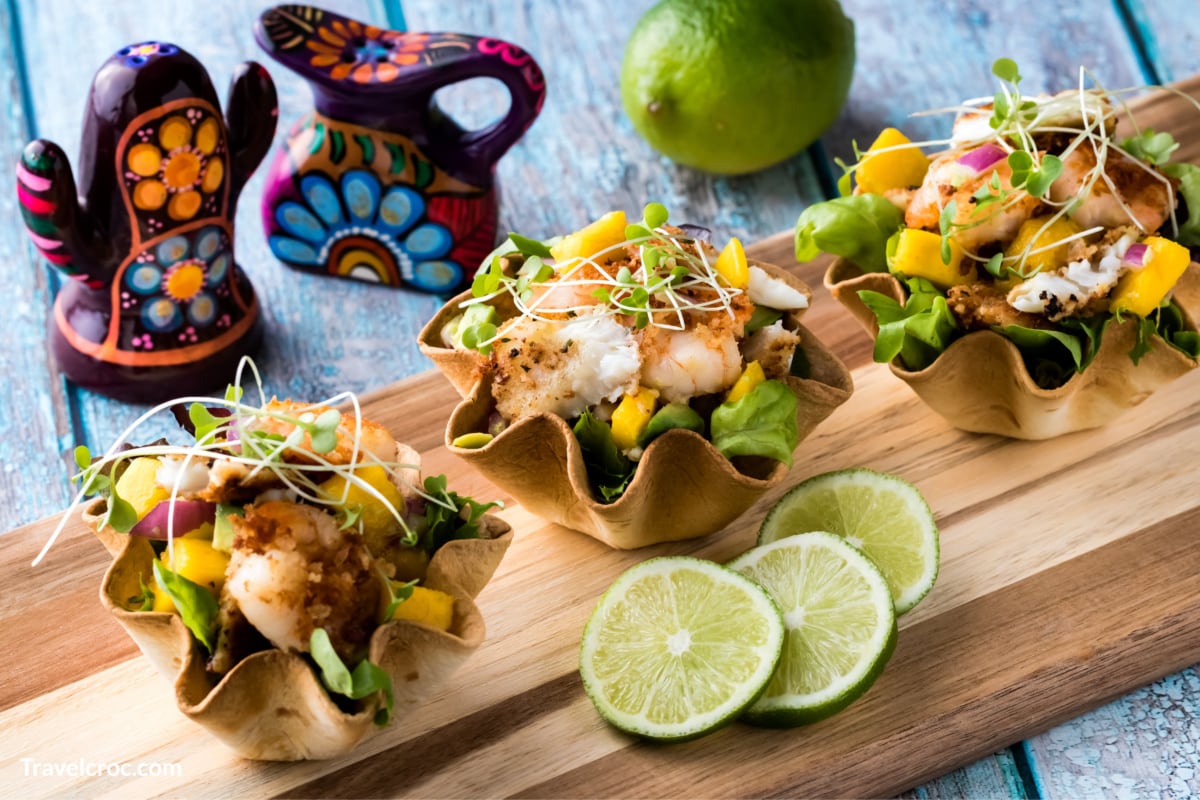 Fish tacos with sole and prawns in mango sauce