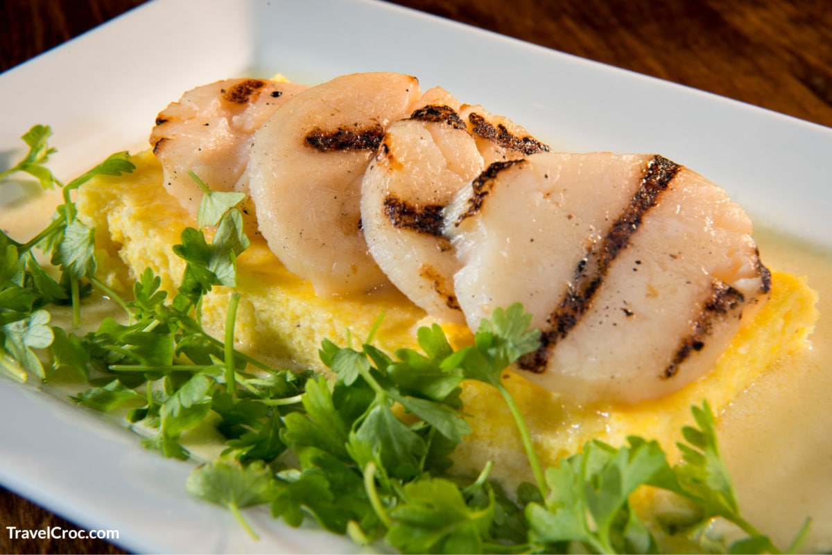 Grilled New Bedford Sea Scallops served on white plate