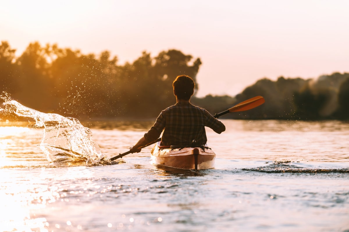 Man Kayaking on a river