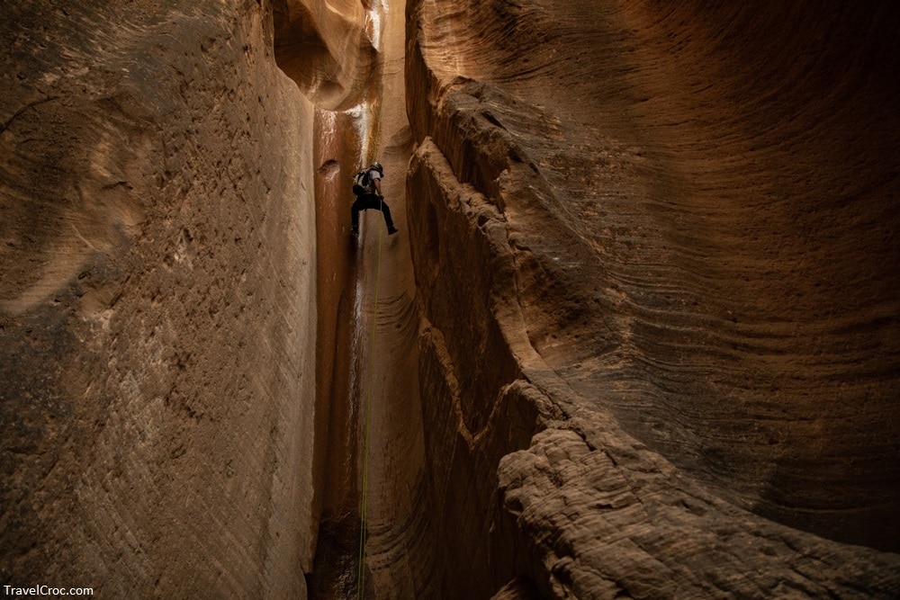 Man rappelling in Zion National Park Utah - Best time to go climbing at Zion National Park 
