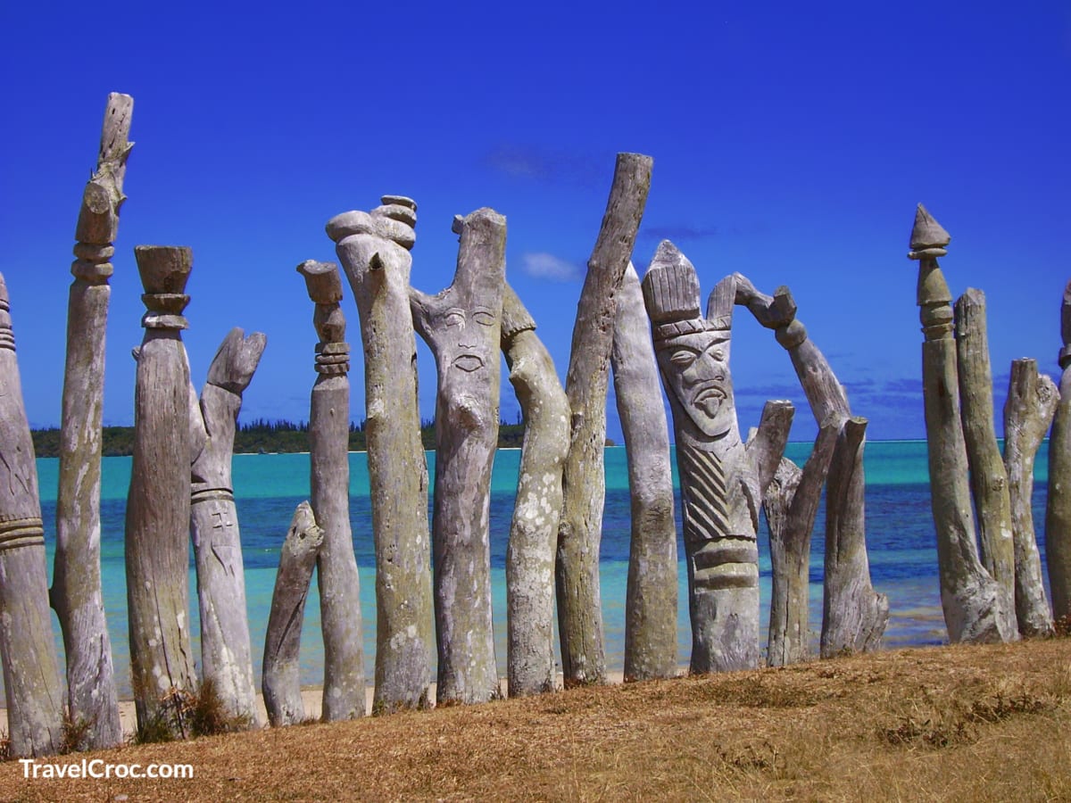 Natives wooden sculpture of protective spirits around the Memorial of the first mass on New Caledonia isalnd
