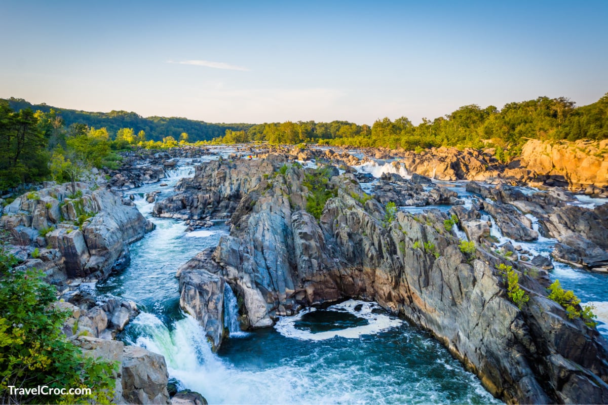iew of rapids in the Potomac River at sunset, at Great Falls Park, Virginia.