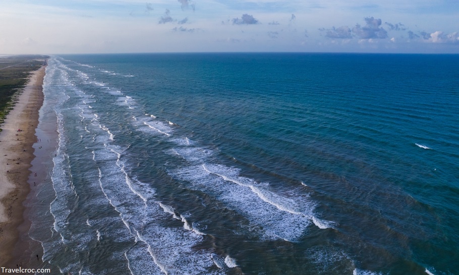 waves crashing along the endless Beach over South Padre Island Beach , Texas , USA Aerial Drone view above gorgeous South Texas Beach