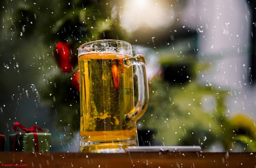 A glass of Beer, with snow and christmas.