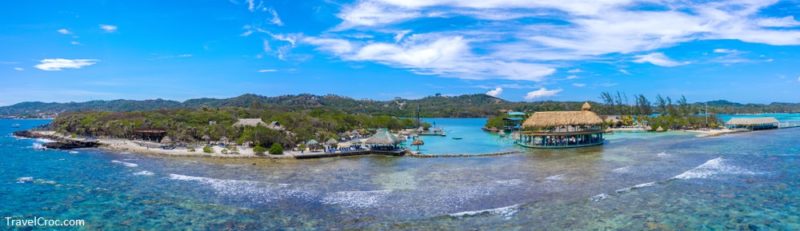 Aerial drone scenic view of Roatan coastline with Barrier coral reef and blue sky