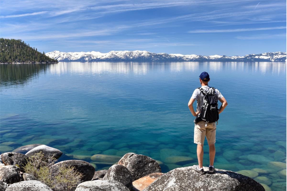 Hiker standing and enjoying view of Lake Tahoe