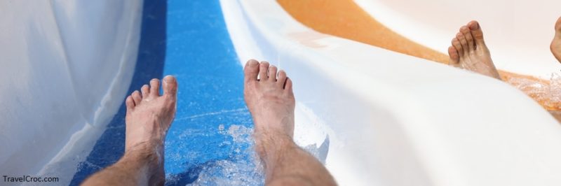 Male feet on slide in a water park while descending - Things to do in Idaho in Summer