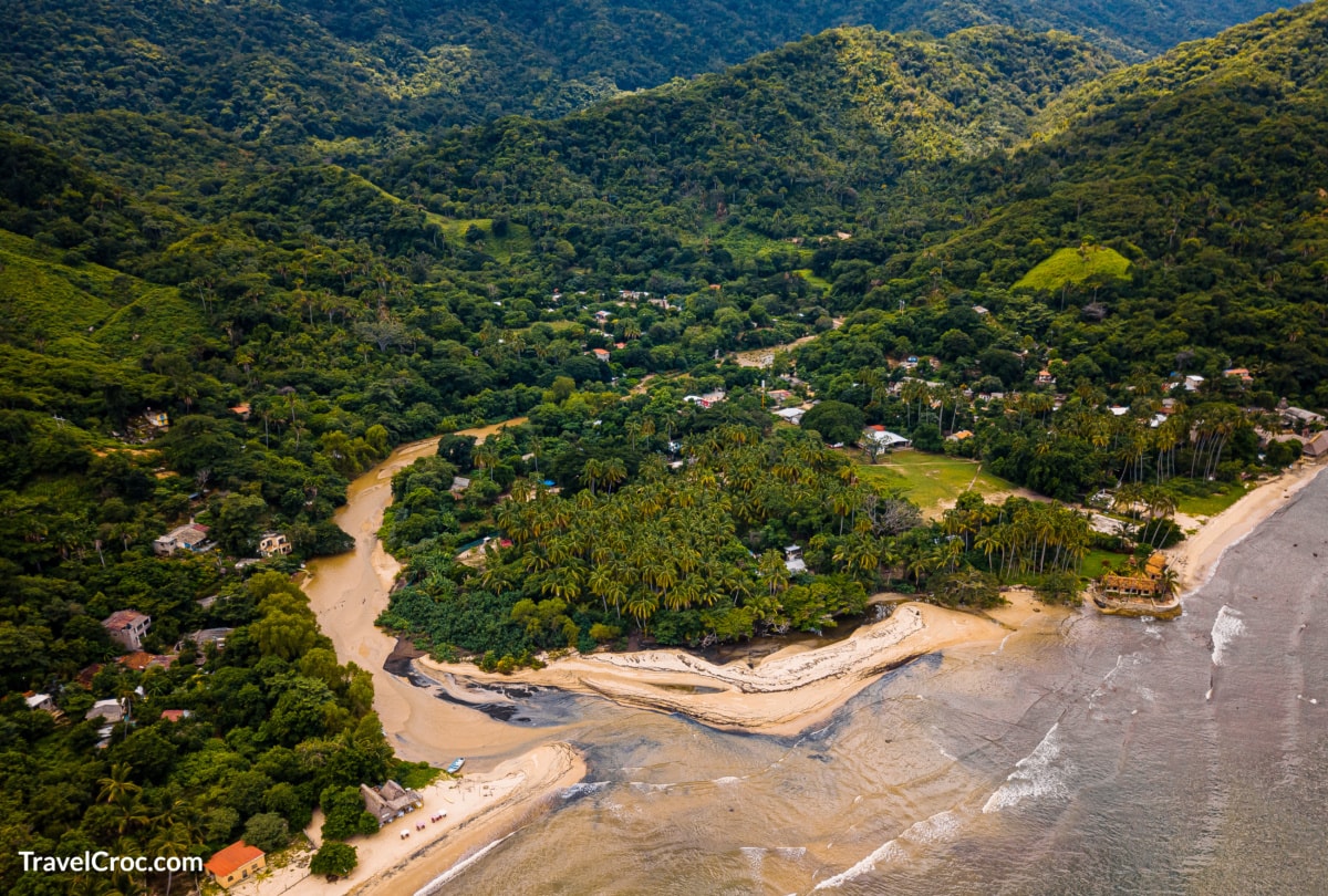Quimixto Falls with views of beach.