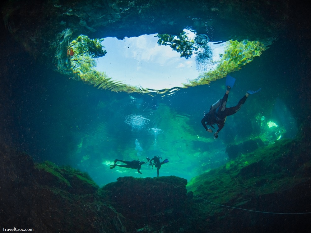 Scuba divers exiting from a Cenote - Cenote Ponderosa, Playa del Carmen, Quintana Roo, Mexico