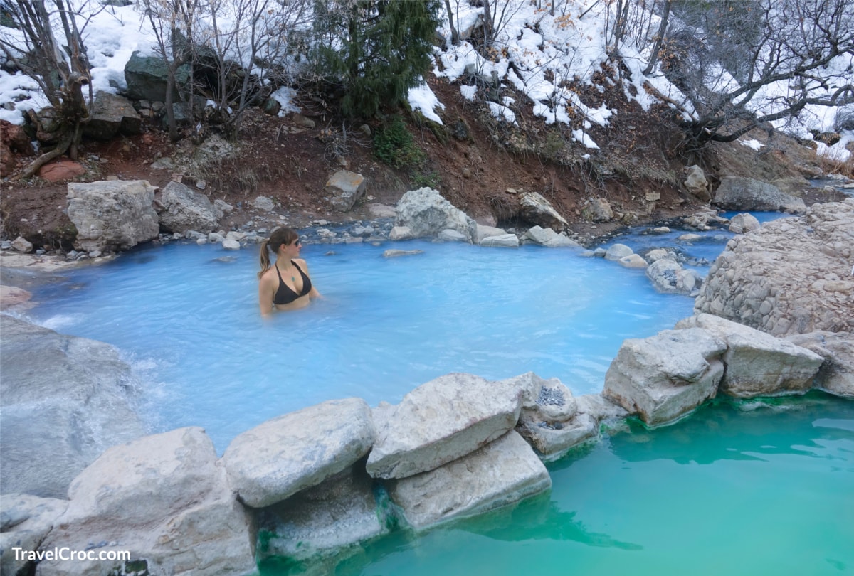 Things to do in Utah in winter - woman enjoying natural hot springs in Utah