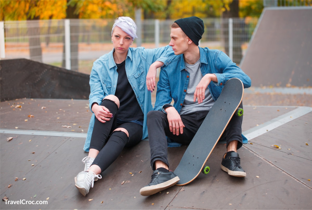 Young guy and girl skateboarders