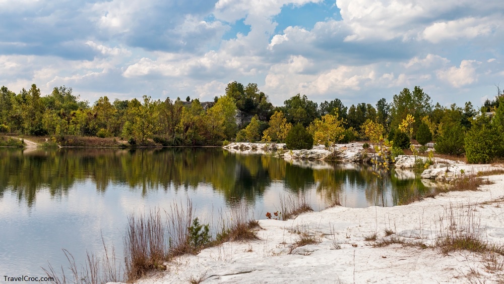 landscape of a lake with a white sand shoreline on a cloudy day at Klondike Park in Augusta, MO