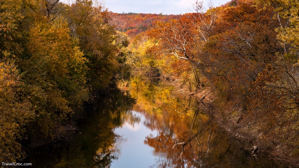 River landscape with colorful autumn trees reflected in the Cuivre river State Park near Troy, MO