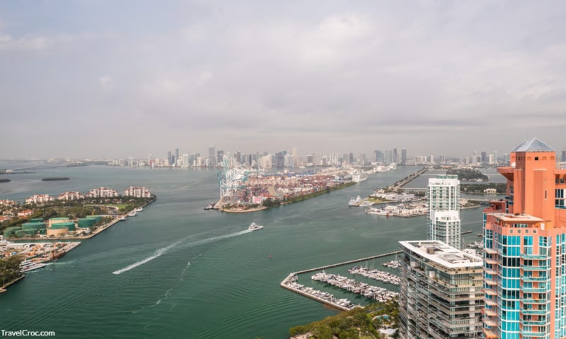 Incredible aerial view over the Miami shipping channels with the skyline on the horizon beyond - ferry from miami to bahamas