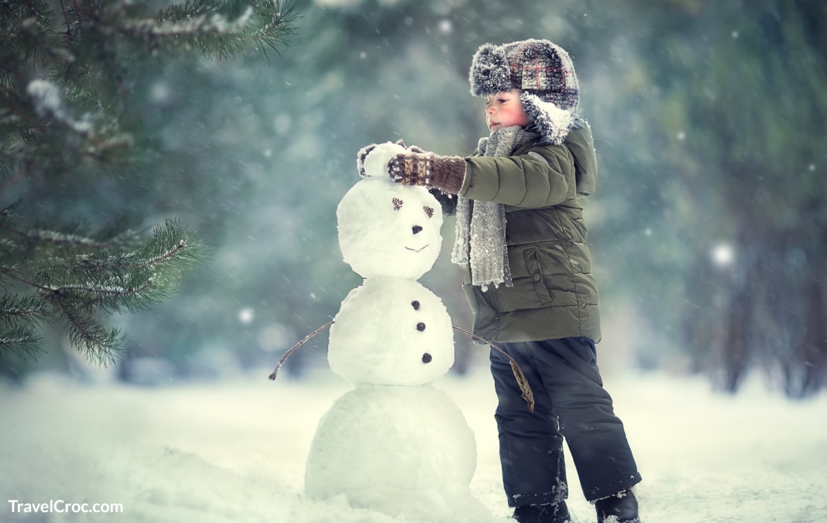 Child building snowman