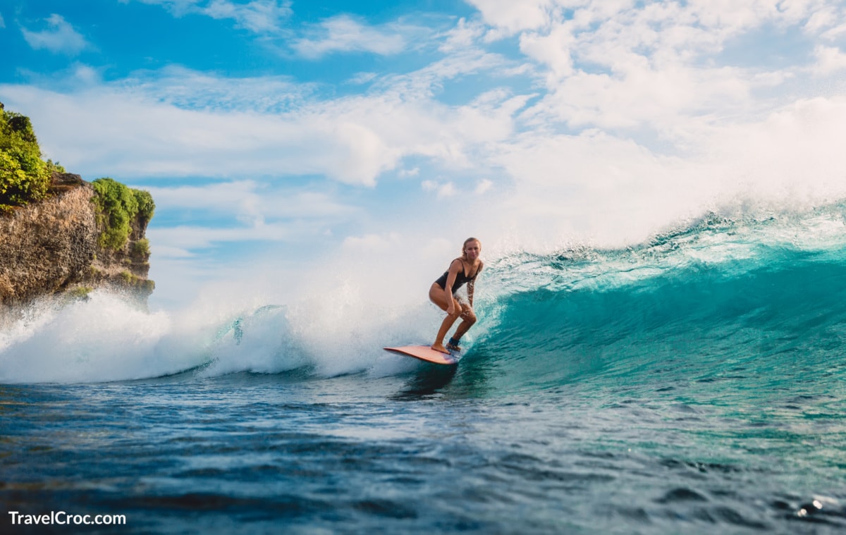 Female surfer in beautiful ocean